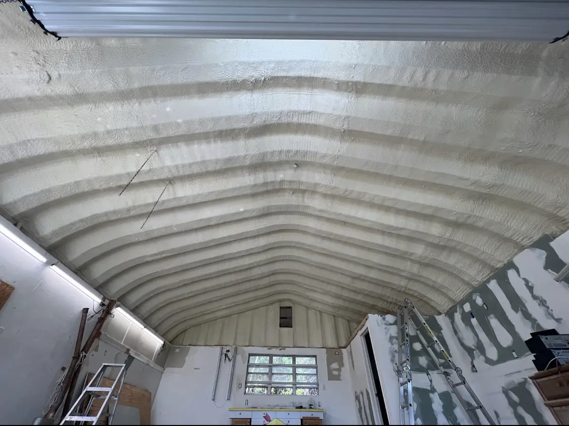 Spray polyurethane foam applied to the underside of a metal roof deck in Whitestown